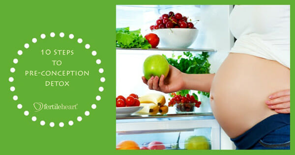 Pregnant Woman reaching for apple from bountiful fridge