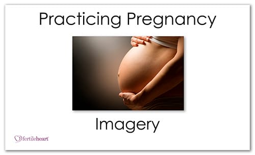 Pregnant Woman holding her belly - Practicing Pregnancy Imagery